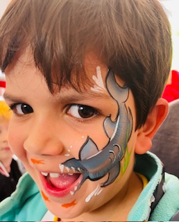 boy with shark face paint in Stafford